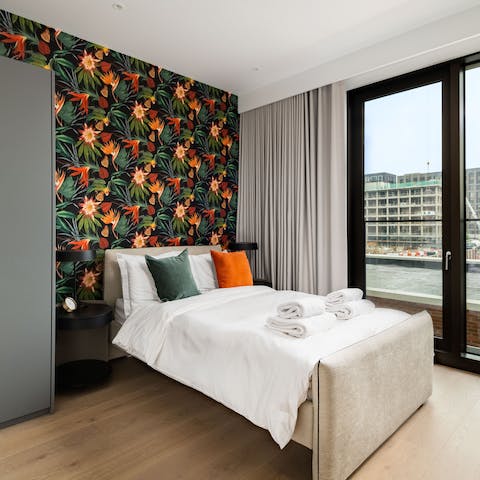 Watch the world, and the water, go by from your bedroom window