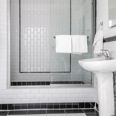Start your day with a relaxing shower in the metro-tile bathroom