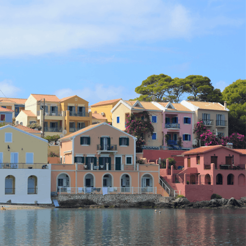 Visit the colourful homes on the coast of Sami, four minutes away by car