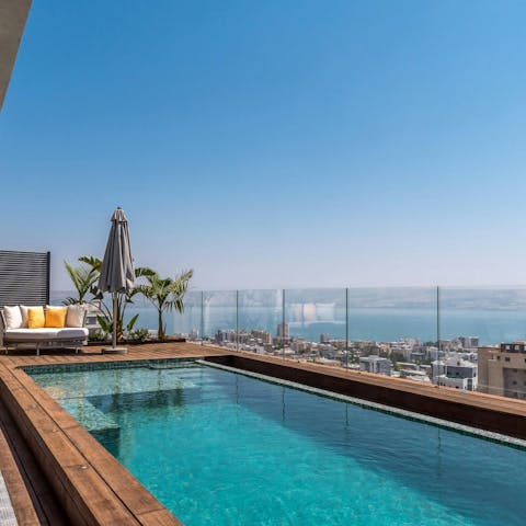 Admire the city and sea views from the private pool
