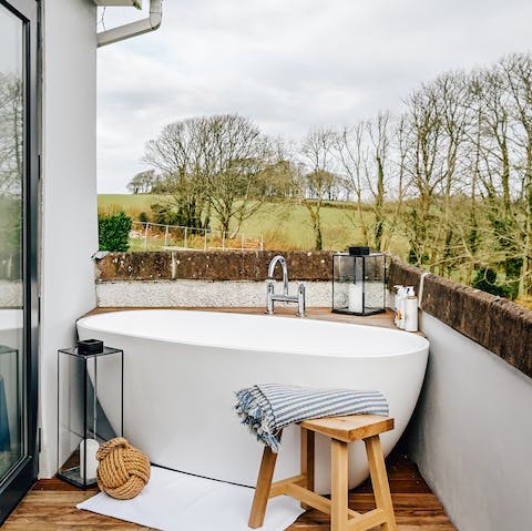 Soak under the stars in the balcony tub