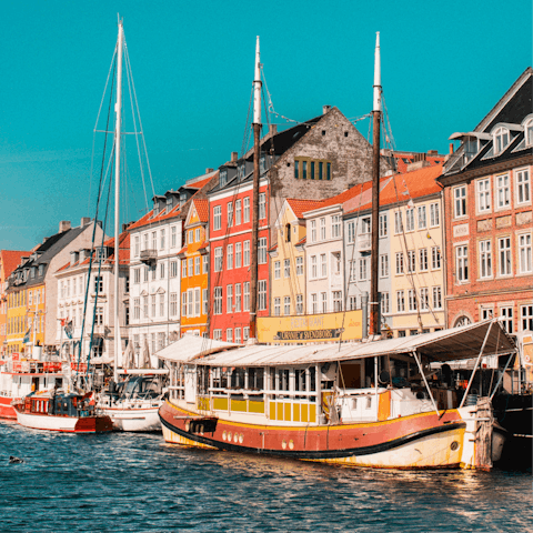 Sip a pint in the sun outside one of Nyhavn's waterside bars and people-watch from the comfort of your seat