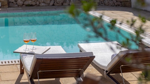 Stretch out beside the pool with refreshing drinks in hand