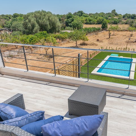 Head out onto the balcony and watch the sun setting beneath the horizon