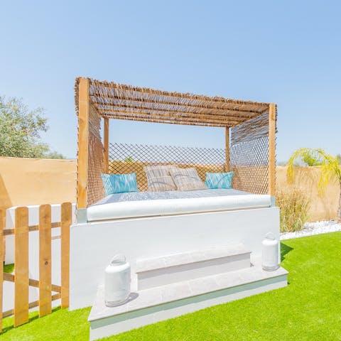 Stretch out on the Balinese daybed for a sun-dappled siesta