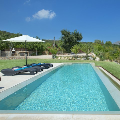 Spend blissful hours relaxing by the saltwater pool, soaking up the sun, and occasionally taking a dip to cool off