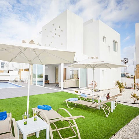 Enjoy a couple of cold drinks in the shade of a parasol outside