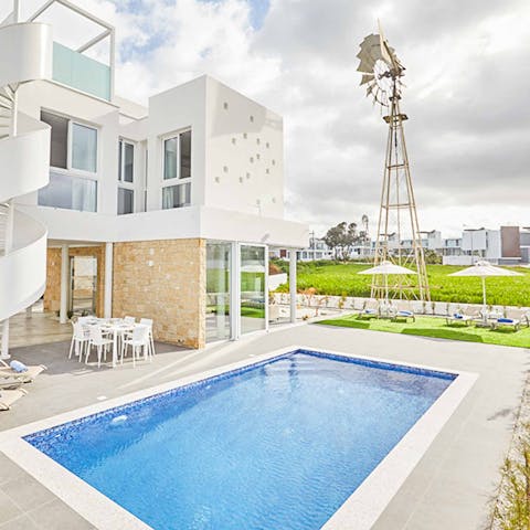 Spend days by the poolside, dipping in and out of the water