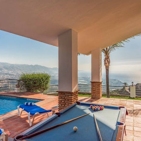 Play a few games of pool on the shady patio
