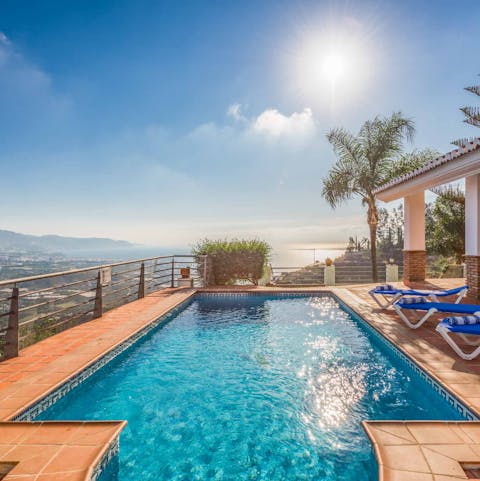 Enjoy a relaxing swim with beautiful views over ocean below