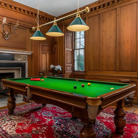 Sip whisky as things get competitive in the games room