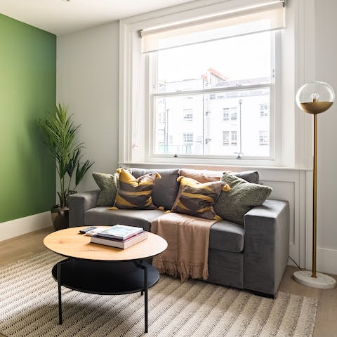 Kick back in the stylish living room with a glass of wine after a day of London sightseeing