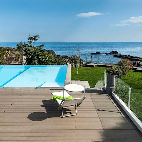 Swim in the shared pool and admire views of the Ionian Sea