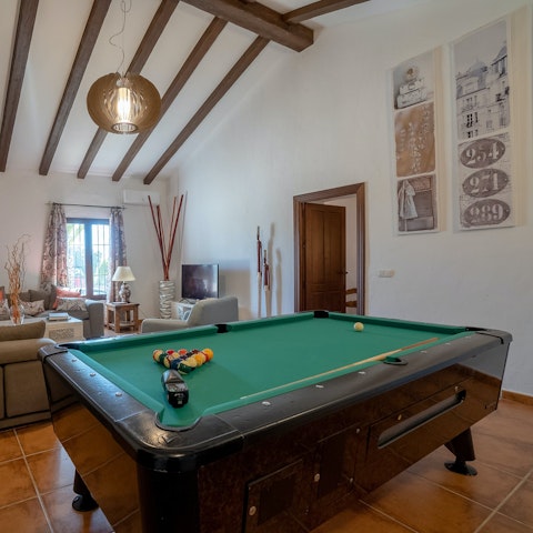 Rack up a game of pool in the living room for social evenings