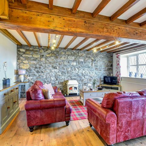 Snuggle up in the home's cosy living room with character features