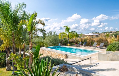 Slip into the pool with rolling Sicilian countryside stretching all around