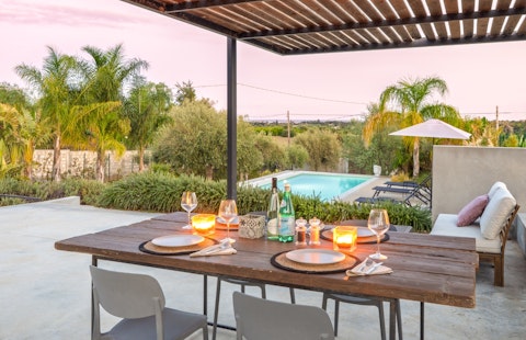 Dine under the pergola as the Sicilian sunset fades
