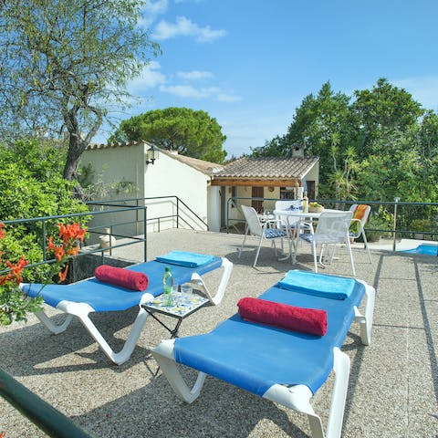 Laze on loungers in the sun or cool off with a cocktail on your raised, private terrace