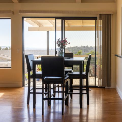 Enjoy a traditional American breakfast around your stylish dining set, offering views out to the hills