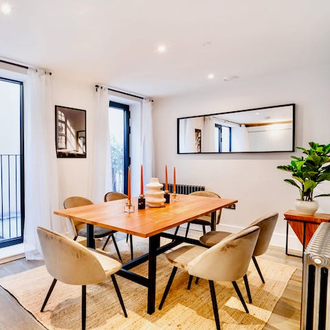 Share a bottle of wine and a delicious meal around the dining table