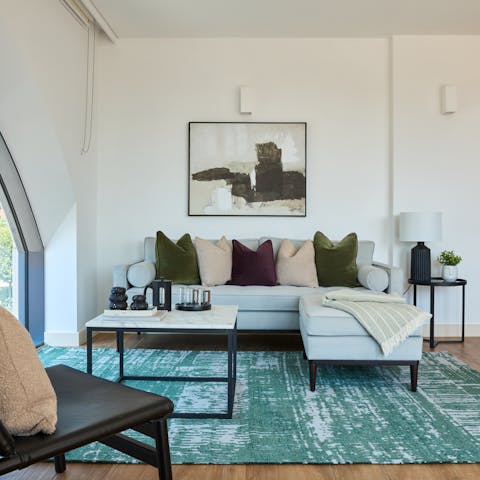 Relax in the bright living room boasting character features