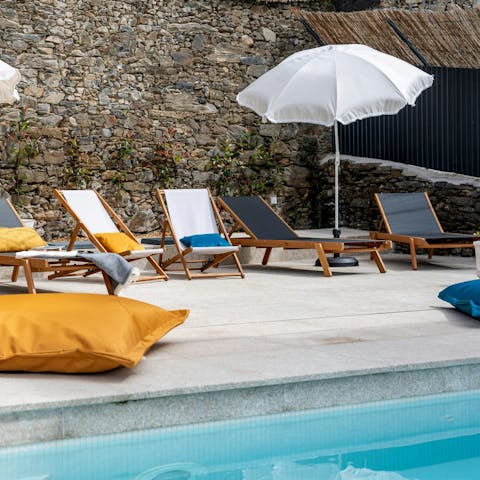 Lounge by the communal pool in the Portuguese sun
