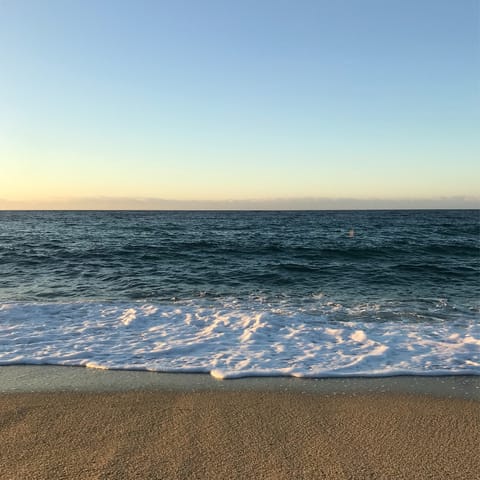 Sink your feet into the sand at Falésia beach, a short walk away
