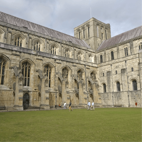 Visit the imposing Winchester Cathedral, a short drive away