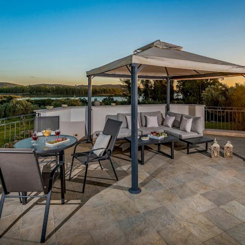 Share cocktails on the terrace as the sun goes down