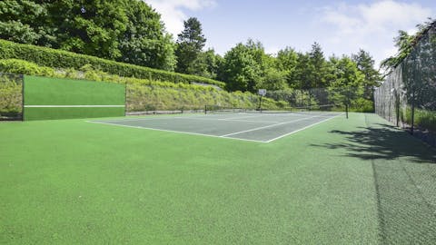 Enjoy an energising game of tennis on the shared court