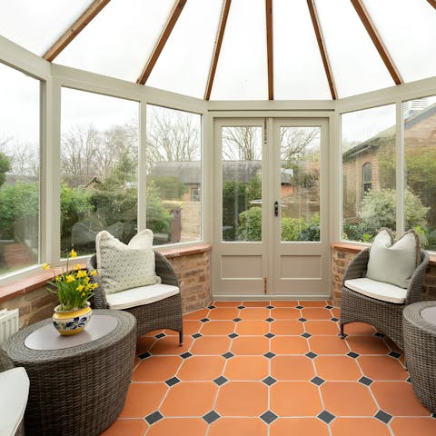 Relax in the conservatory overlooking the private garden