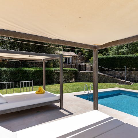 Lounge on the day beds by the pool 