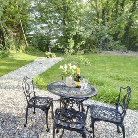 Listen to the bird song in the garden with its woodland setting