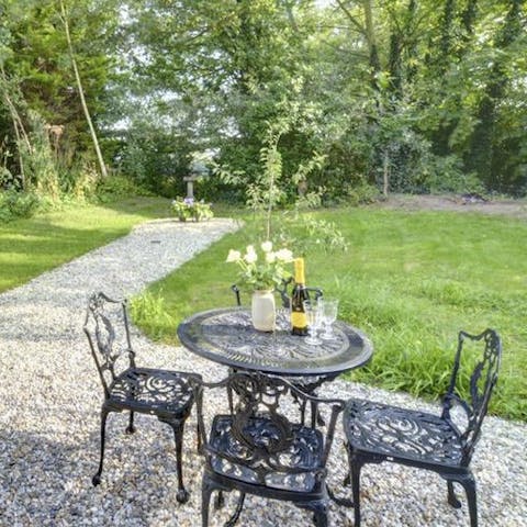 Listen to the bird song in the garden with its woodland setting