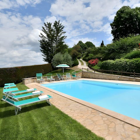 Take a glass of fizz out to the poolside loungers and relax in the sunshine