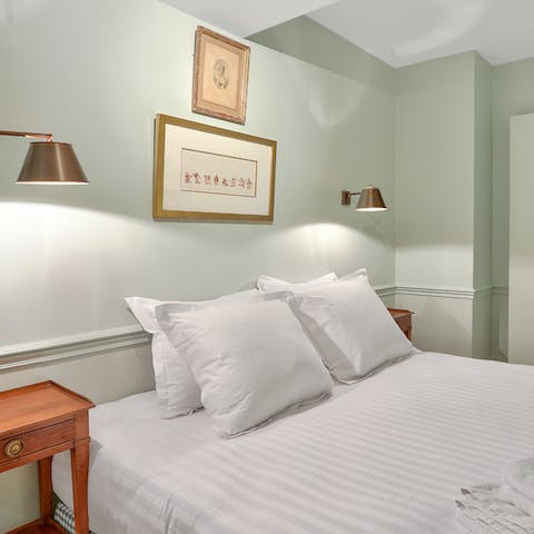 Get a restful night's sleep in the soothing bedroom full of pastel tones