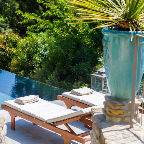 Catch some rays on the poolside lounge chairs