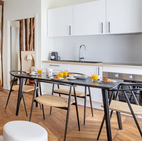 Start your day with a fresh coffee at the sleek dining table