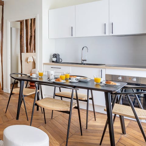 Start your day with a fresh coffee at the sleek dining table