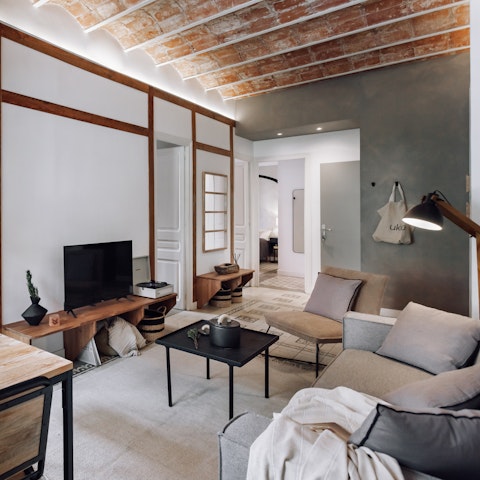 Kick back with the record player or smart TV in the stylish living room
