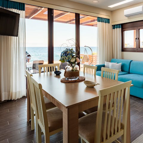 Tuck into delicious Greek cuisine around your stylish indoor dining set