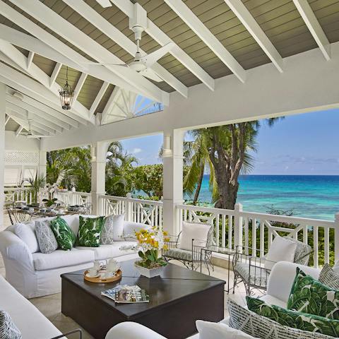 Play cards and drink cocktails on the expansive patio, admiring the view out to sea
