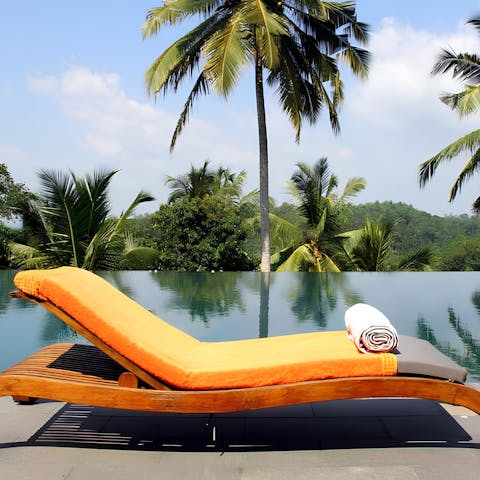 Relax and soak up the sun by the huge infinity pool