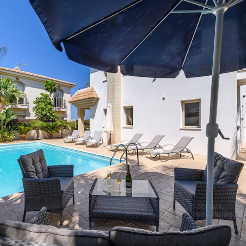 Open the umbrella for much-needed shade when you're enjoying a cold beer on the patio