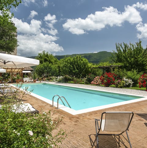 Relax by the pool or take a refreshing swim in its glistening water