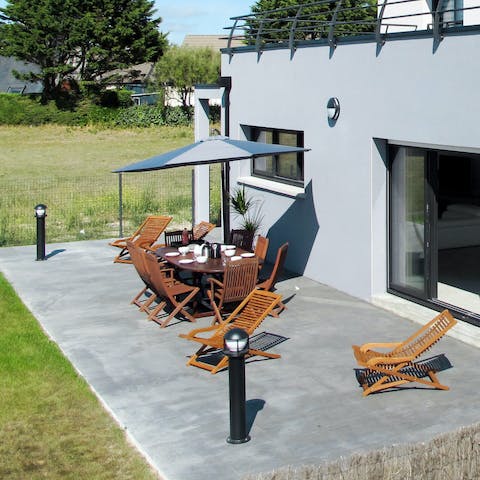 Enjoy the outdoor seating area under the parasol