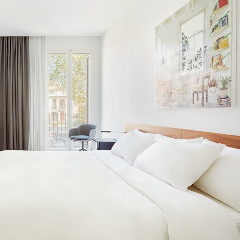 Wake up blissfully in your comfortable bed, the soft breeze washing through the French doors