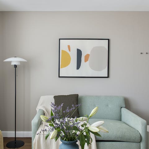 Mix a gin and tonic and get comfortable on the blue velvet sofa for a relaxed night in