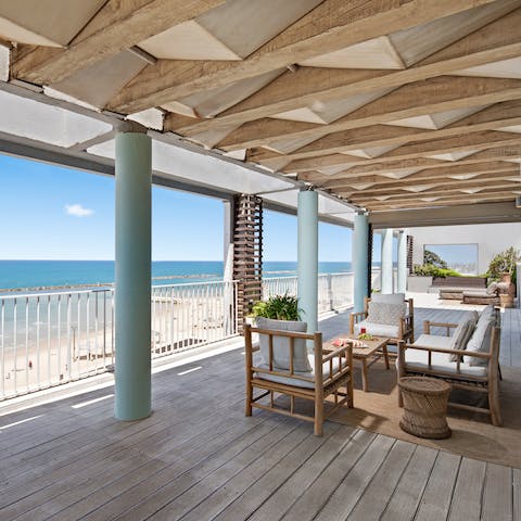 Sit out on the shaded patio with a glass of arak and gorgeous views