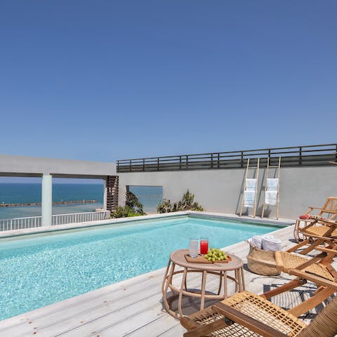 Lie back by the private pool and soak up the sun